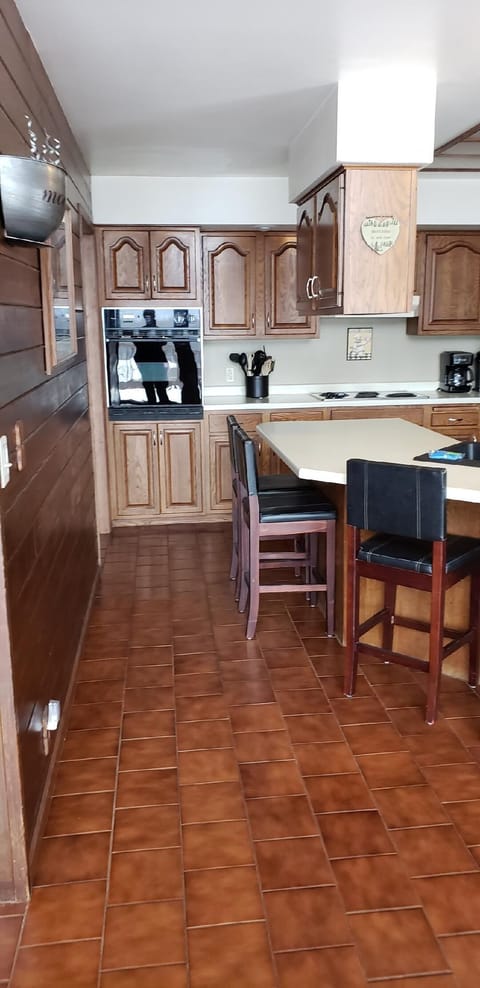 Kitchen.  Blender, crockpot (2), griddle, roaster pan and electric roaster.