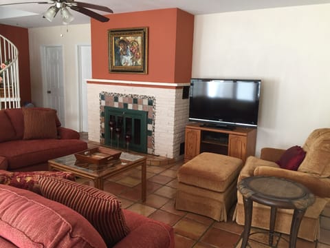 Comfortable living room with large screen tv and working fireplace