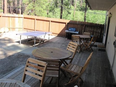 Plenty of tables and chairs for enjoying ping pong matches and BBQ in backyard