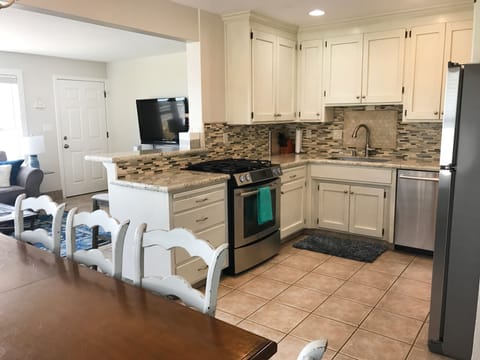 kitchen with bar into living room