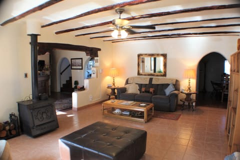 Main living area at Hacienda de Leyba with wood burning stove. 
