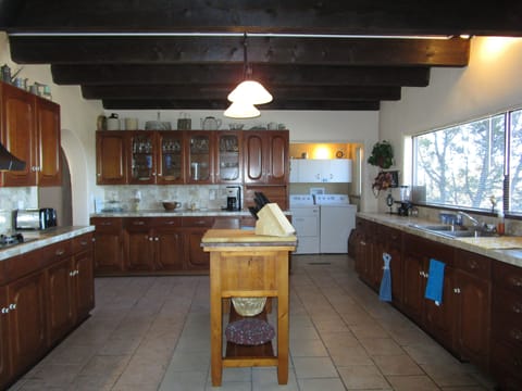 Washer & dryer are in room off of kitchen.  