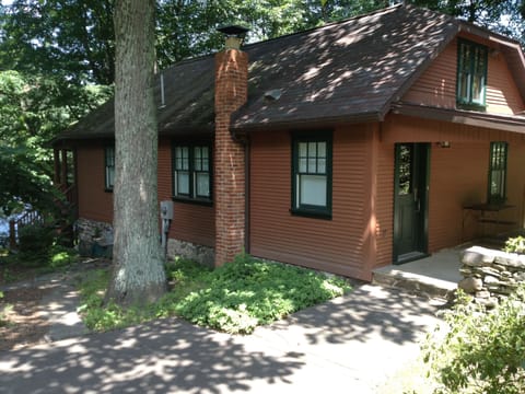 Cottage in profile with lake down below