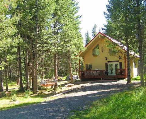 From the front porch, you can hear the birds singing and the wind rushing through the fragrant pines.