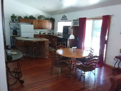 house kitchen, stove top island, eating bar & dining table