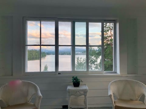 Second floor hideaway porch off the primary and guest bedrooms. Serene lake view