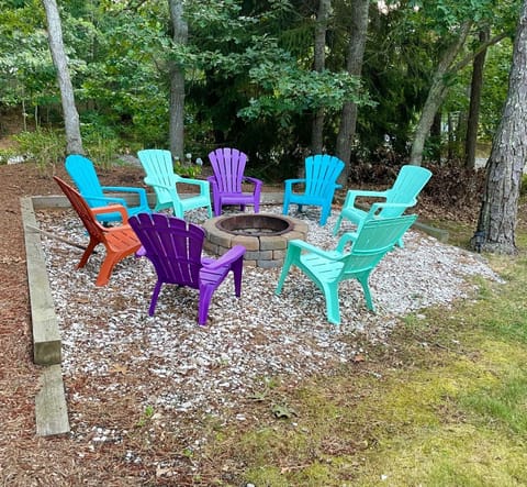 Relax by the fire pit or in the nearby hammock after a day at the beach.