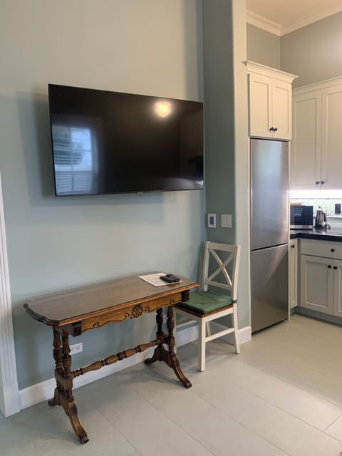 Moveable, wall mounted TV and writing/laptop desk (can be expanded in a pinch)