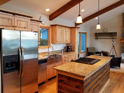 Modern, well equipped kitchen with gas range.