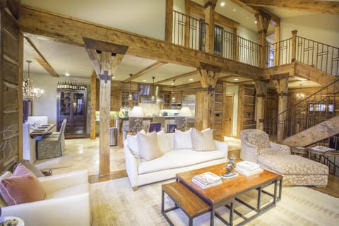 Warm and inviting living room opens to the kitchen and dining area.