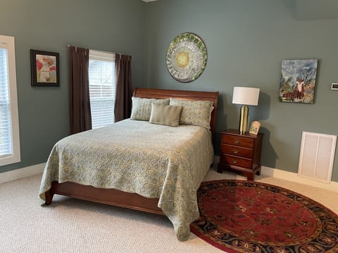 Queen bed all original art hung in loft.