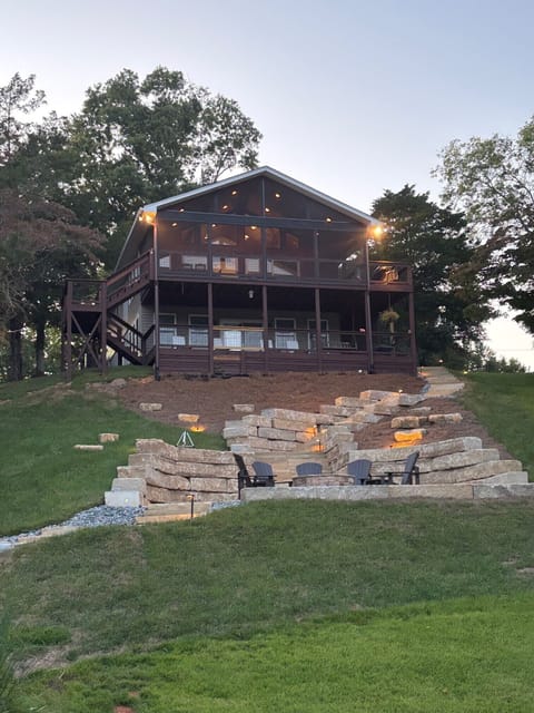 Beautiful patio in back year with fire pit over looking our cove.