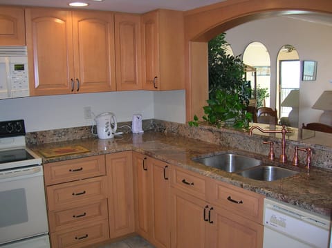 Pass-through from kitchen to dining area showing  dishwasher