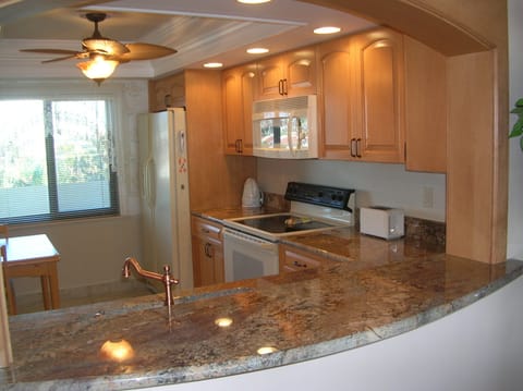 Granite kitchen -  microwave, range, side-by-side fridge