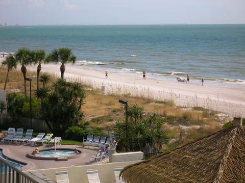 Spa/pool links to beach of pale, fine  sand