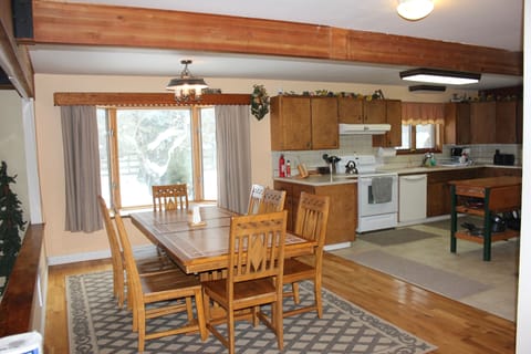 Part of the kitchen and a second dining table, which overlooks living room table

