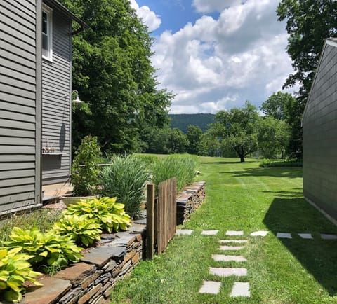 Edge of driveway looking at the field, garage on your right.