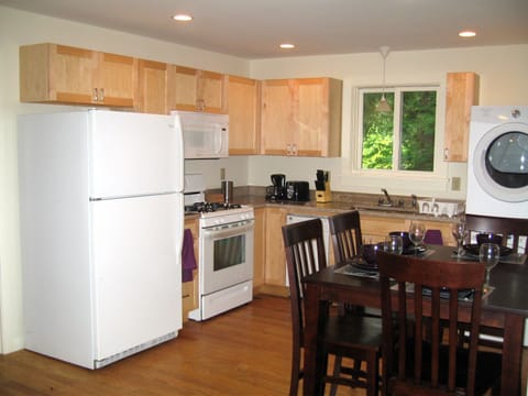 Kitchen with dishwasher. In unit washer and dryer. 