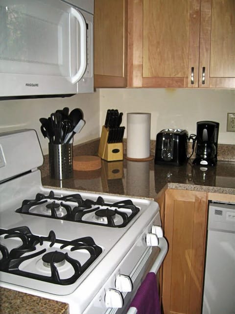 Kitchen includes cooking utensils, toaster & coffee maker