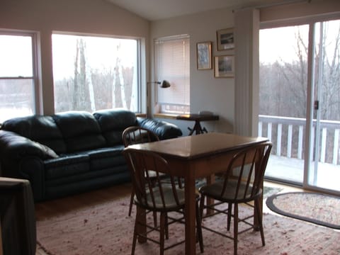 view of dining and living area from bedroom doorway