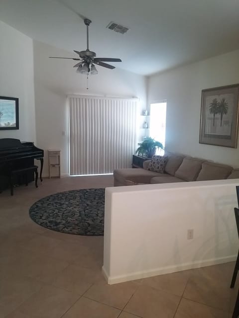 Family Room with large sectional and piano.