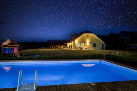 night view of the house from the swimming pool