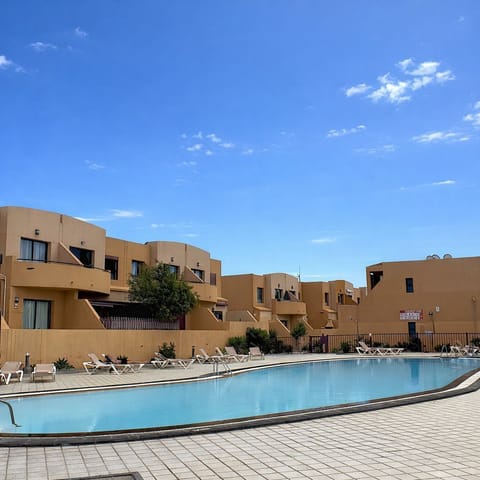 Pool area with available sun beds 