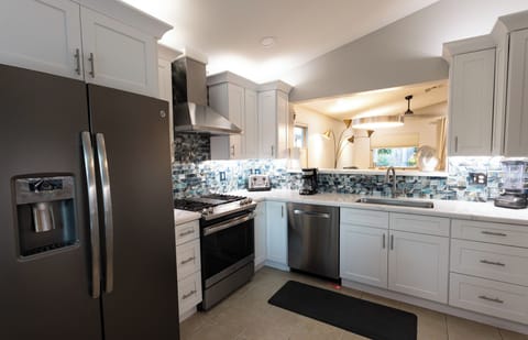 Newer appliances, ceiling fan, & garden table seating for 2.