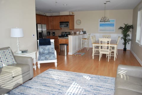 The living room is open to the kitchen and dining area.