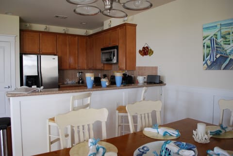 Eat at table or counter while looking out to the beach.