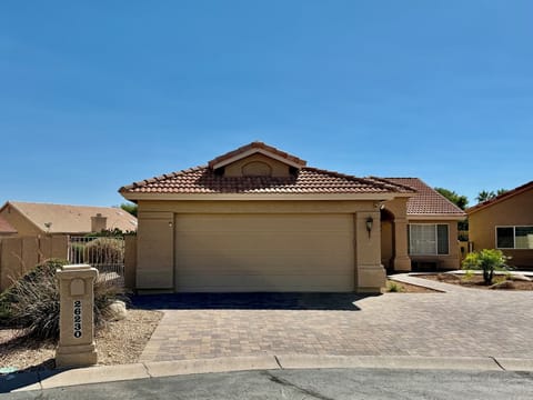 Front of house with large back yard.