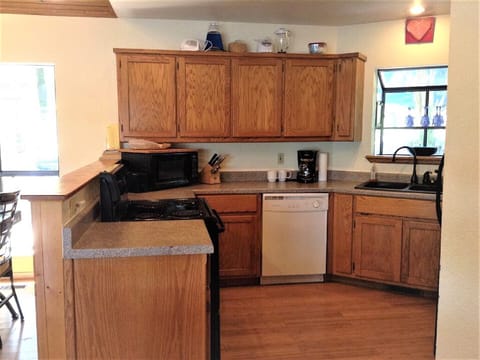 Kitchen with microwave, drip coffee maker, toaster and blender