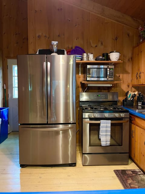 View of new stainless steel appliances in kitchen.
