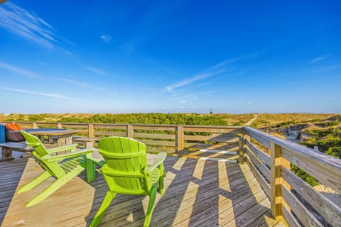 Picture yourself unwinding in bright green Adirondack chairs on your private deck, soaking up sunshine with endless natural views stretching before you.