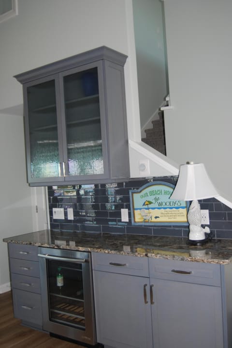 Bar with beverage refrigerator ( off main living area )