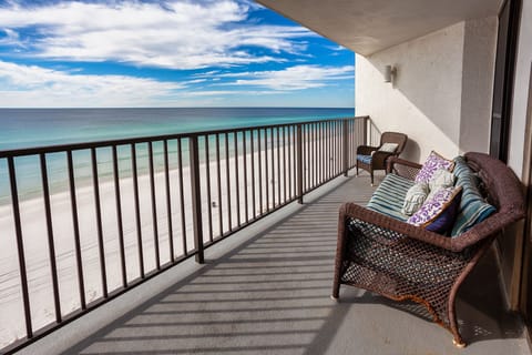 Watch the waves from our generously sized balcony, angled to watch the sunsets.