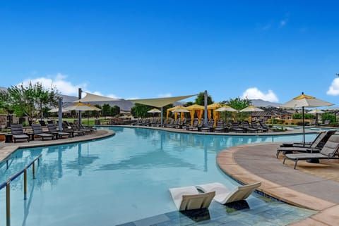 Huge Community Pool with plenty of seating and cabanas-1 block away