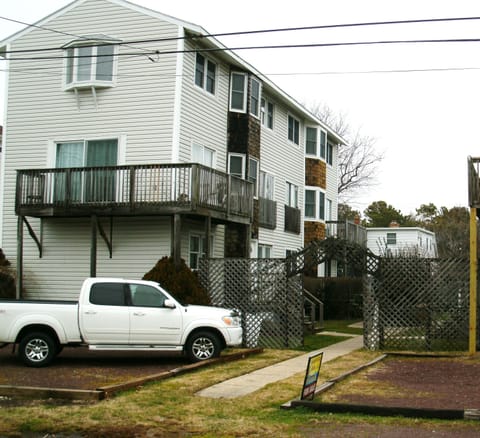 outside condo, with private parking area