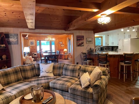 Family Room with Kitchen to the left and Dining Room in the background.