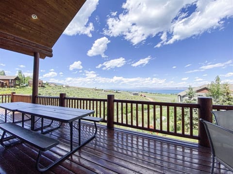 Scenic deck with picnic table and lake views—ideal for outdoor meals and peaceful moments