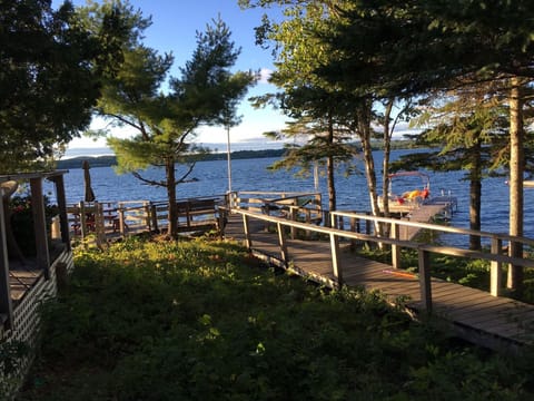 View from upper deck overlooking lower deck, dock and lake