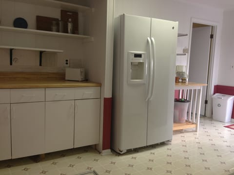 second half of kitchen; full fridge; lots of storage and prep areas