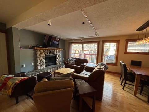 Comfortable seating in the living area with 2 love seats and 2 chairs.