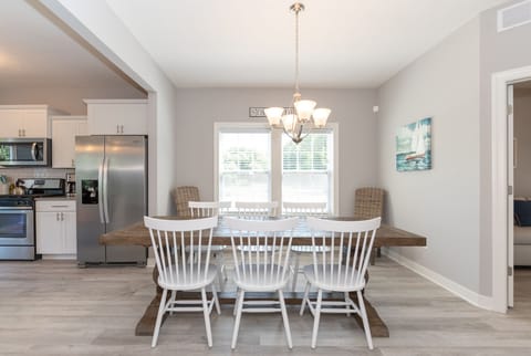 Dining table with chairs for 8.  Two additional chairs upstairs if needed. 