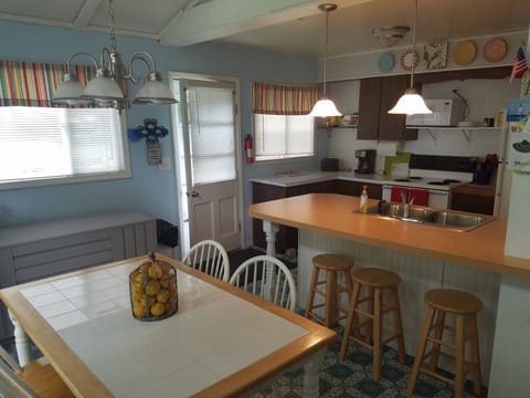 Dining room and kitchen with breakfast bar area