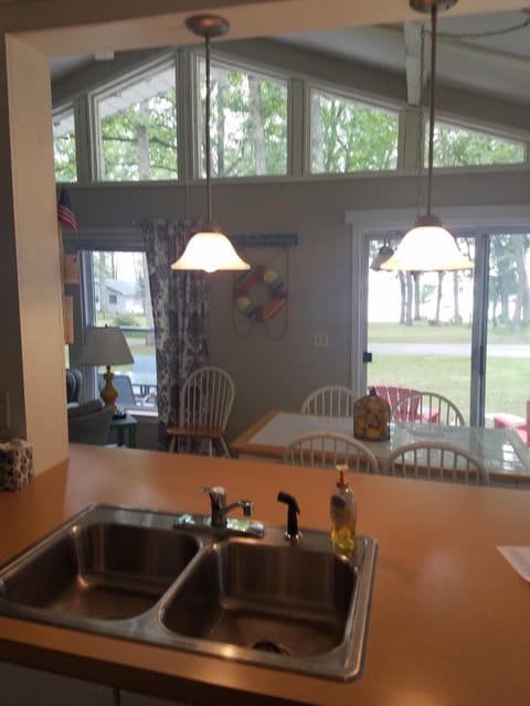 Kitchen view looking out to front of cottage and patio