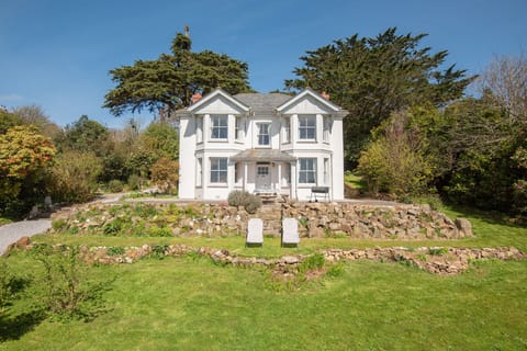 The house surrounded by gardens
