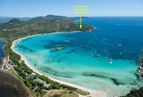 Pannoramuc view of the Santa Giulia Bay with indication of the house location