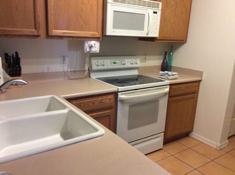 Flat surface electric stove; full size oven; and microwave