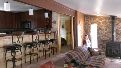 Kitchen with bar and master bedroom entrance